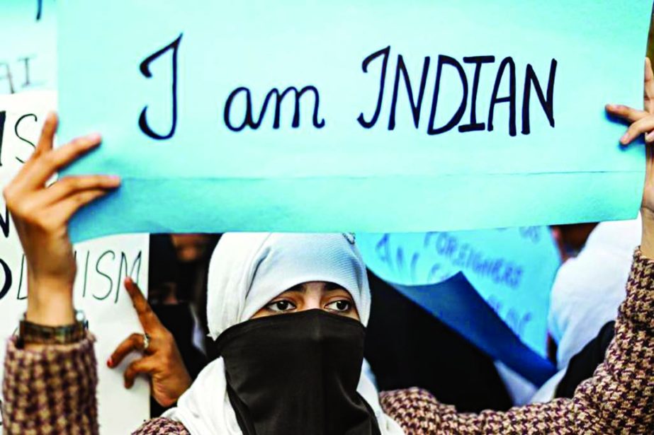 A protester displays a placard during a demonstration against the Indian government's Citizenship Amendment Bill in New Delhi on Saturday. Internet photo