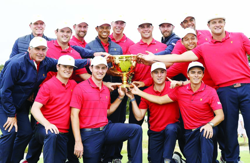 The U.S. team hold their trophy after they won the President's Cup golf tournament at Royal Melbourne Golf Club in Melbourne on Sunday. The U.S. team won the tournament 16-14.