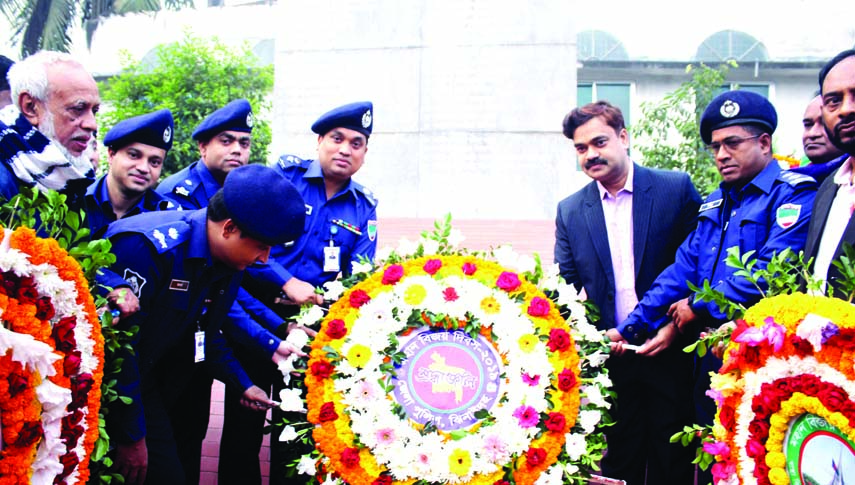 JHENAIDAH: Saroj Kumar Nath, DC and Hasanuzzaman, SP, Jhenaidah placing floral wreaths at Jhenaidah Central Memorial marking the Victory Day on Monday.