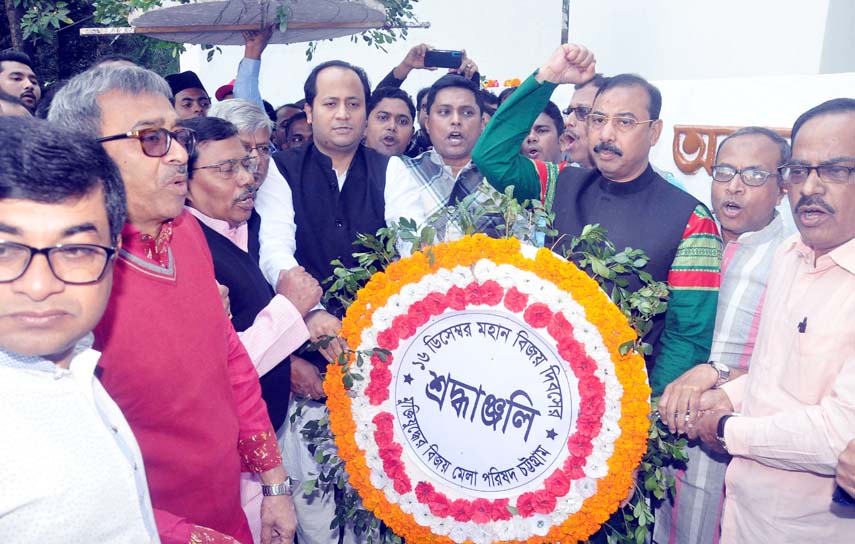 Deputy Minister for Education Barrister Mohibul Hasan Chowdhury Nowfel MP and CCC Mayor A J M Nasir Uddin placing floral wreaths at the Shaheed Minar in observance of the Victory Day on Monday.