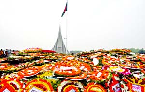Savar National Memorial bedecked with flowers marking the 49th Victory Day on Monday.
