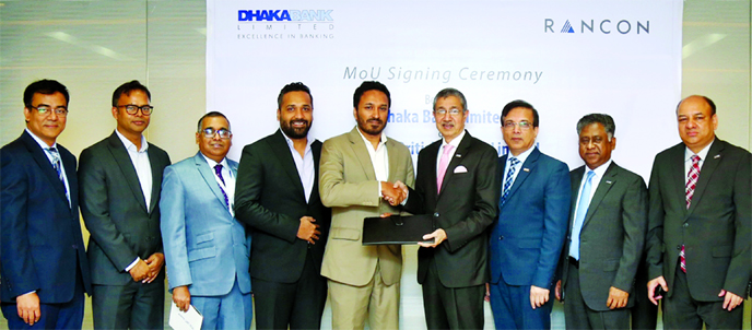 Emranul Haque, Managing Director (CC) of Dhaka Bank Limited and Mohammad Samir Uddin, Chief Financial Officer of Rancon British Motors Limited, exchanging an agreement signing document at the bank's head office in the city recently. Top officials from bo