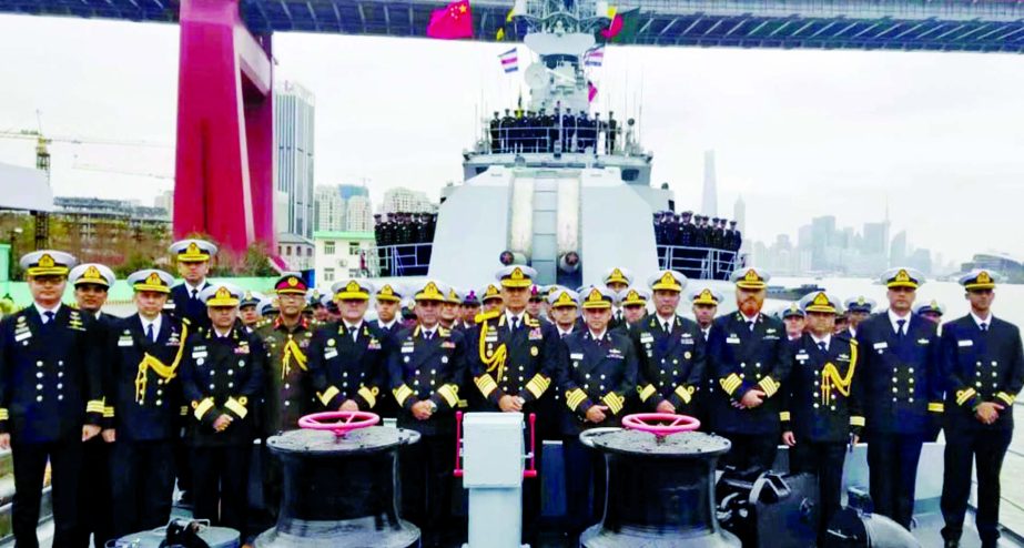 Navy Chief Admiral Aurangzeb Chowdhury, along with other members of Navy poses for a photo session at the handing over ceremony of two warships of Bangladesh Navy at Senzia Shipyard in Sanghai on Wednesday. ISPR photo