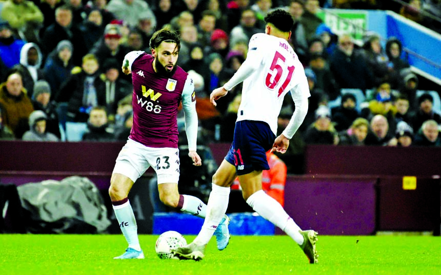 Aston Villa's Jose Ignacio (left) duels for the ball with Liverpool's Ki-Jana Hoever during the English League Cup quarter final soccer match between Aston Villa and Liverpool at Villa Park in Birmingham, England on Tuesday.