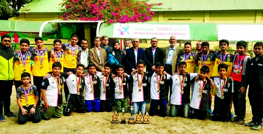 Principal, Vice-Principals, Teachers of Manarat International School and College with champions and runners-up in the Inter-Class Football Tournament of Manarat International School pose for a photo session after prize-giving ceremony at the school campu