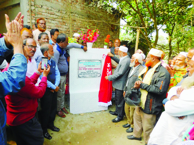 ISHWARGANJ (Mymensingh): Abdus Sattar, Mayor, Ishwarganj Pourashava inaugurating the construction work of RCC road at Kakanhati Village as Chief Guest on Wednesday.