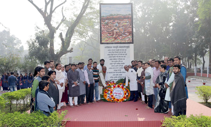 Vice-Chancellor (acting) of Bangabandhu Sheikh Mujibur Rahman Science and Technology University Prof Dr Md. Shahjahan paying tribute to the Martyred Intellectuals by placing floral wreaths at the Gopalganj District Shaheed Memorial with teachers, students