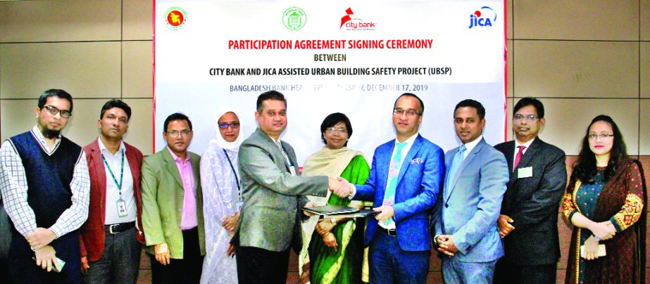 Mashrur Arefin, CEO of City Bank Limited and Md. Sharafat Ullah Khan, Project Director of Urban Building Safety Project, SME & Special Programmes Department of Bangladesh Bank (BB) under JICA assisted, exchanging document after signing an agreement at BB