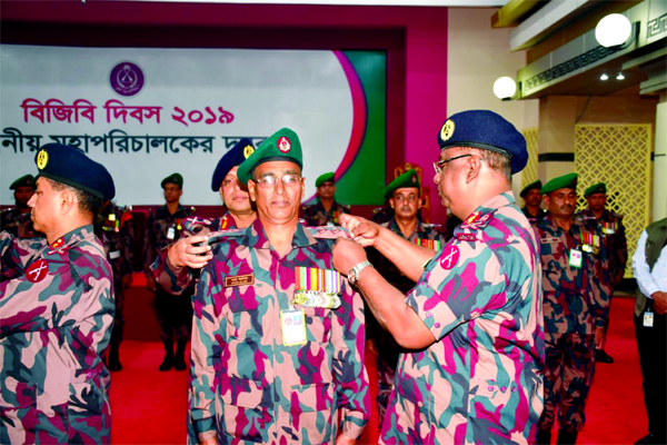 Some BGB members being adorned with badges for their contributions in operational and academic sectors in Bir Uttam Fazlur Rahman Khondkar Auditorium of BGB Headquarters in the city's Pilkhana on Thursday marking BGB Day-2019.