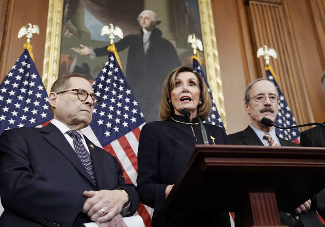 Speaker of the House Nancy Pelosi, D-Calif., flanked by House Judiciary Committee Chairman Jerrold Nadler, D-N.Y., left, and House Foreign Affairs Committee Chairman Eliot Engel, D-N.Y., speaks reporters at the Capitol in Washington on Wednesday after the