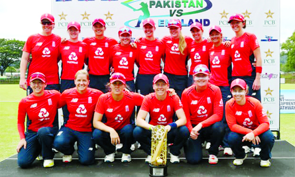 Players of England Women's Cricket team pose with the trophy after beating Pakistan by 26 runs in the final match of the Twenty20 series to secure a 3-0 series victory at Kuala Lumpur in Malaysia on Friday.
