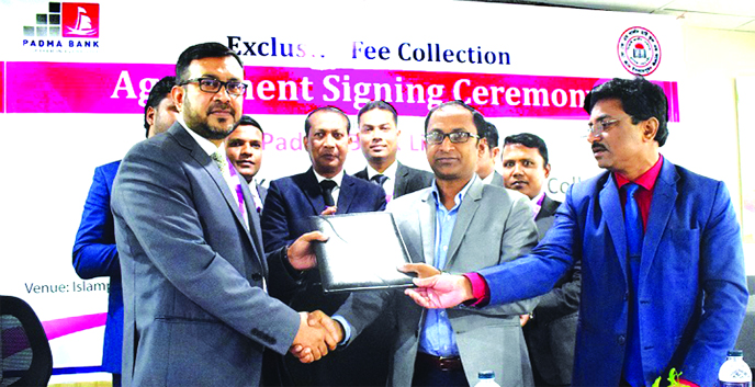 Amirul Islam, the Head of Corporate Liability of Padma Bank and Md Abdus Salam Chowdhury, Principal of the J.J.K.M. Girls High School and College, exchanging documents after signing an agreement at the bank's Islampur Branch in Jamalpur on Wednesday. Isl