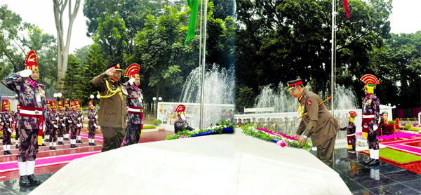 BGB Director General Major General Safinul Islam paying tributes to the liberation war martyrs by placing wreaths at Simanta Gourab in the city's Pilkhana on Friday marking BGB Day.