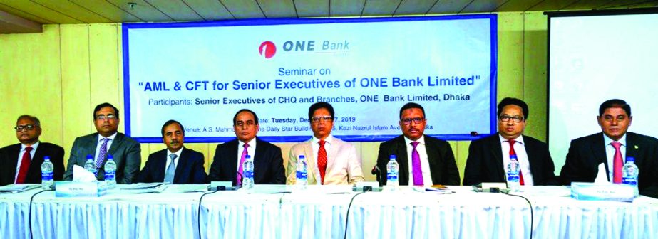 Sudhir Chandra Das, CAMLCO of ONE Bank Limited, presiding over a seminar on "AML & CFT for Senior Executives of ONE Bank" at AS Mahmud Hall of The Daily Star building in the city recently. Bank's Managing Director M Fakhrul Alam and General Manager Md