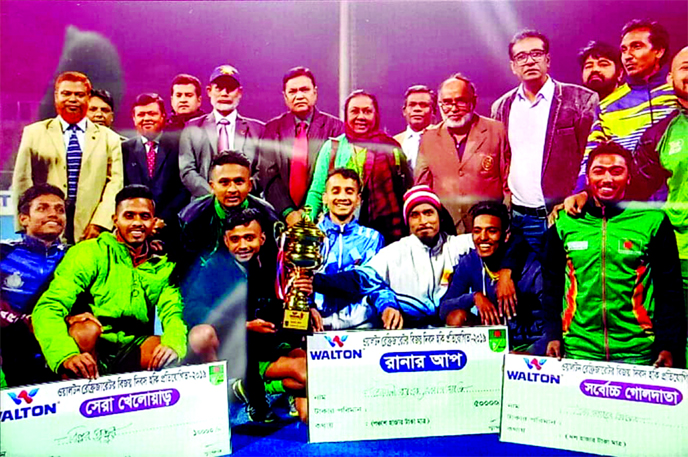 Players of Sonali Bank Limited, the runners-up in the Walton Refrigerator Victory Day Hockey Competition with Md Ataur Rahman Prodhan,CEO and Managing Director of Sonali Bank Limited, Md Shahed Ali, Jakir Hossain Khan, General Managers of Sonali Bank Limi