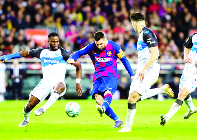Barcelona's Lionel Messi scores a goal during a Spanish La Liga soccer match between Barcelona and Alaves at Camp Nou stadium in Barcelona, Spain on Saturday.