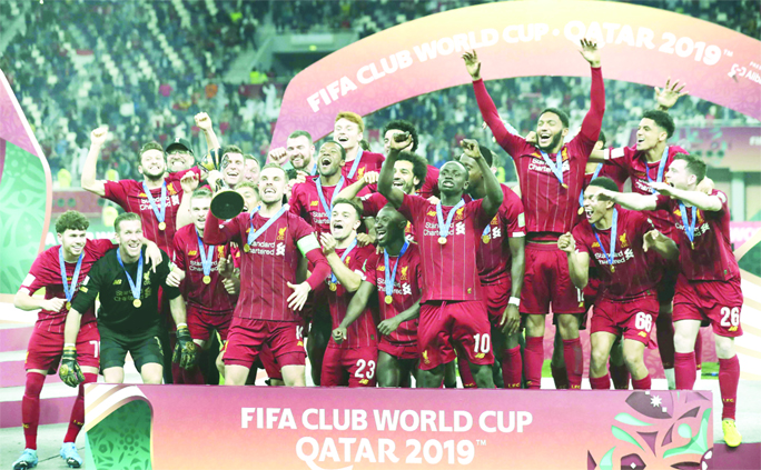 Players of Liverpool celebrate after winning the Club World Cup final soccer match between Liverpool and Flamengo at Khalifa International Stadium in Doha, Qatar on Saturday.
