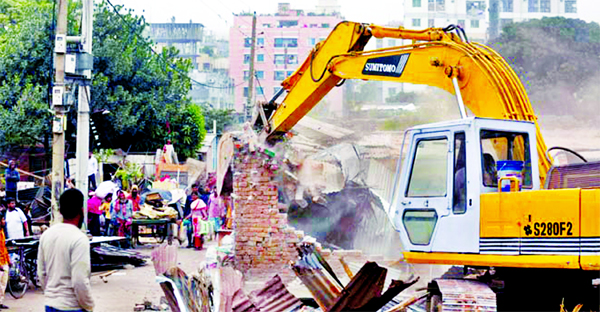 Illegal structures were bulldozed at Duaripara in city's Mirpur on Sunday by the Works Ministry.