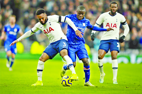 Tottenham's Danny Rose (left) is challenged by Chelsea's N'Golo Kante during the English Premier League soccer match between Tottenham Hotspur and Chelsea, at the Tottenham Hotspur Stadium in London on Sunday.