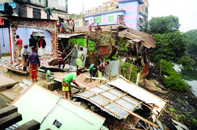 BOGURA: Illegal structures were evicted by District Administration from Karatoa River Bank in Bogura on Monday.