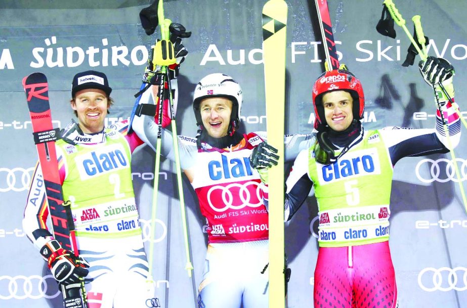 Norway's Rasmus Windingstad (center) winner of an alpine ski, men's World Cup parallel giant slalom, poses on the podium with second placed Germany's Stefan Luitz (left) and third placed Austria's Roland Leitinger, in Alta Badia, Italy on Monday.