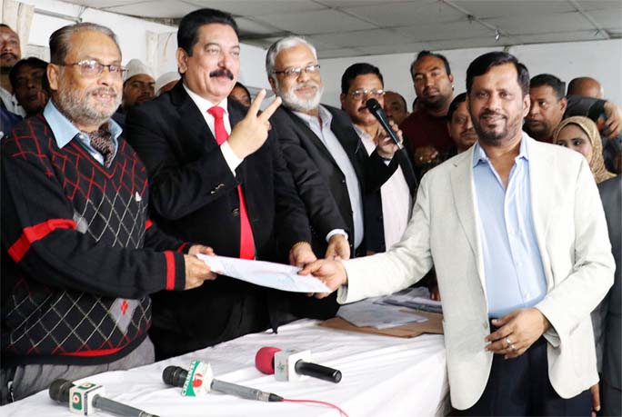 Jatiya Party Chairman GM Kader, MP distributing nomination forms among the party candidates at its office in the city on Wednesday for Dhaka North City Corporation election.