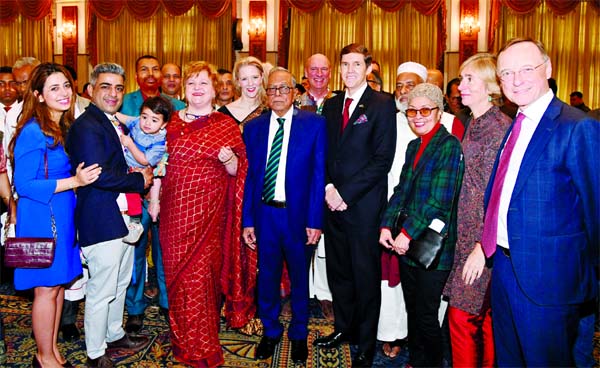 President M. Abdul Hamid poses for a photo session with diplomats after exchanging greetings with the members of Christian community on the occasion of Christmas Day at Bangabhaban on Wednesday.