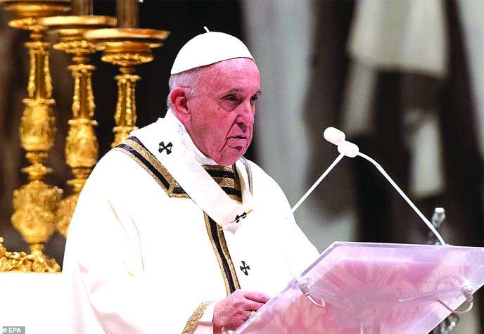 Pope Francis leads a Christmas Eve mass in St Peter's Basilica to mark the nativity of Jesus Christ on Tuesday at the Vatican.