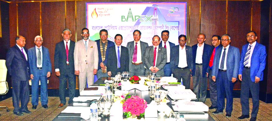 Chairman of Bangladesh Petroleum Exploration & Production Company Limited (BAPEX) Board and Senior Secretary of Energy and Mineral Resources Division Abu Hena Md Rahmatul Muneem, poses for photograph along with the high officials of the company at its 30t