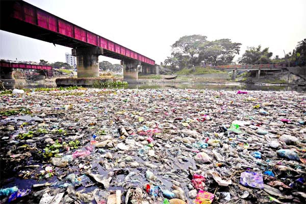 River or dumping spot: A major portion of Turag River filled with huge garbage threatening its existence. This photo was taken from Tongibazar area on Wednesday.