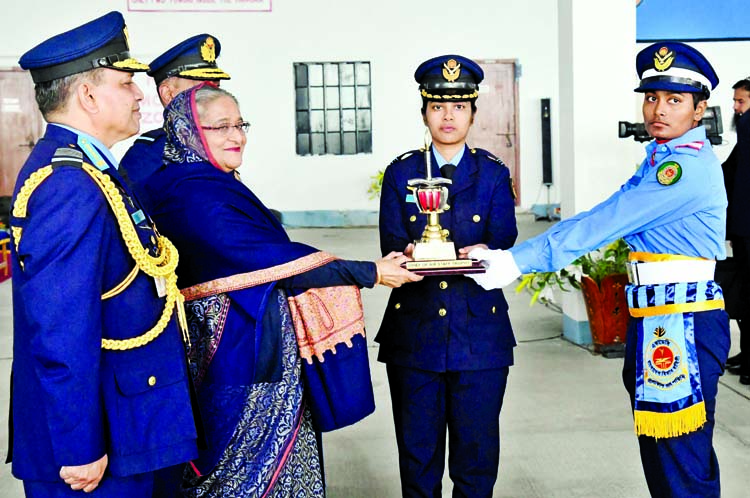 Prime Minister Sheikh Hasina handing over trophy among the Bangladesh Air Force (BAF) cadets at a ceremony held at the parade ground of the BAF Academy in Jashore on Thursday marking the President Parade-2019 of the passing out cadets of No. 76 BAFA Cours
