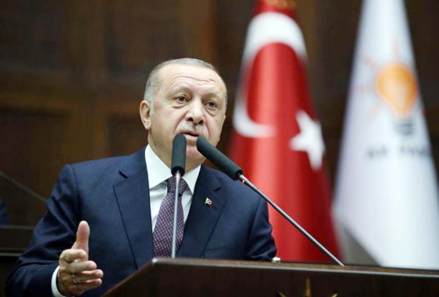 Turkish President Erdogan addresses lawmakers from his ruling AK Party during a meeting in Ankara