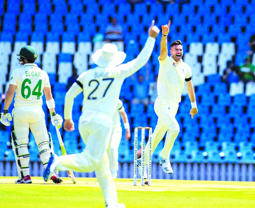 England's bowler James Anderson (right) celebrates with teammates after dismissing South Africa's Dean Elgar (far left) for a duck on day one of the first cricket Test match between South Africa and England at Centurion Park in Pretoria of South Africa