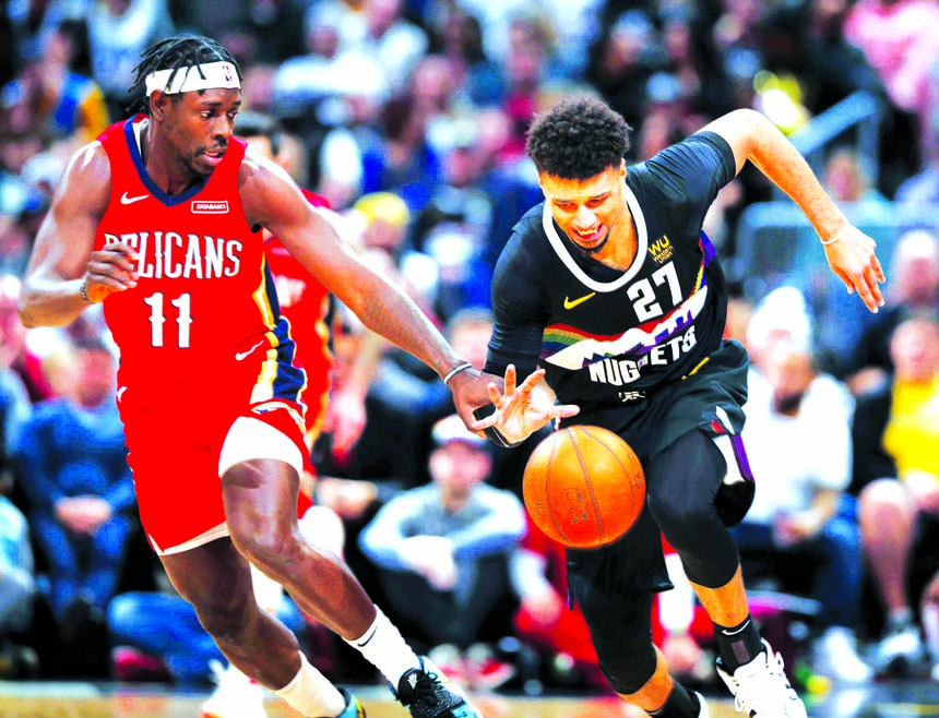 Denver Nuggets guard Jamal Murray (right) and New Orleans Pelicans guard Jrue Holiday pursue the ball during the second half of an NBA basketball game in Denver on Wednesday. The Pelicans won 112-100.