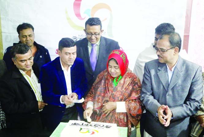 TONGI (Gazipur): Member of Parliament from reserved seat Begum Samsun Nahar Bhuiya cutting cake marking the founding anniversary of the Daily Iffefaq on Wednesday.