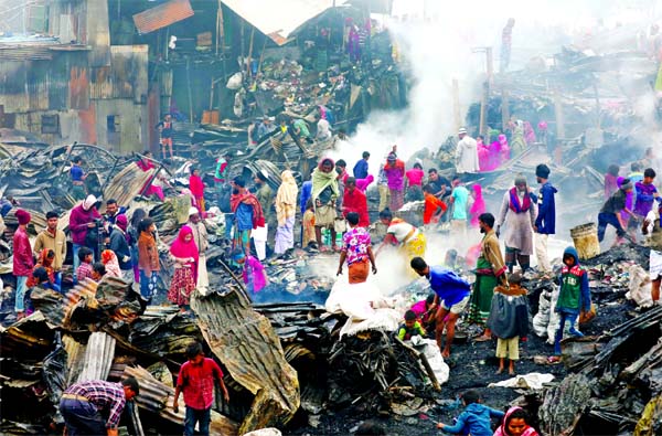 About 20 shanties and 40 shops were gutted at a fire that broke out at one of Baunia slums in city's Kalshi area of Mirpur on Friday midnight.