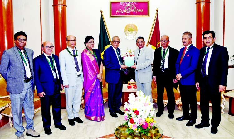 A delegation led by Bangladesh University Grant Commission Chairman Prof Dr Kazi Shahidullah submitting annual report of the Commission to President M Abdul Hamid at Bangabhaban yesterday. Photo : PID