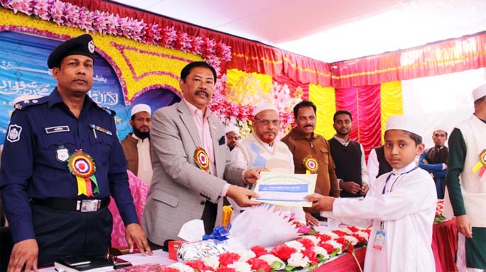CHT Affairs Minister Bir Bahadur Ushwi Sing MP distributing certificates and cash money among the winners of 7th Quaran and Azan competition as Chief Guest on Thursday.