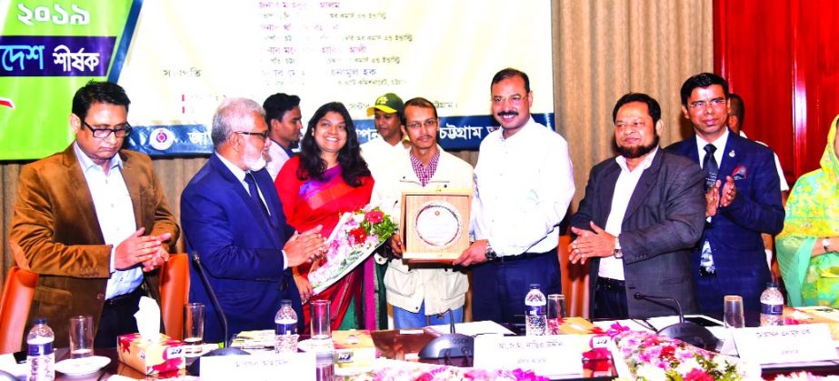 A J M Nasir Uddin, Mayor of Chattogram City Corporation, handing over crest to Md. Abdul Quader Munshi, Director of Ocean Paradise Hotel & Resort Ltd for paying the highest Value Added Tax (VAT), at the district-level in Cox's Bazar district, for fiscal