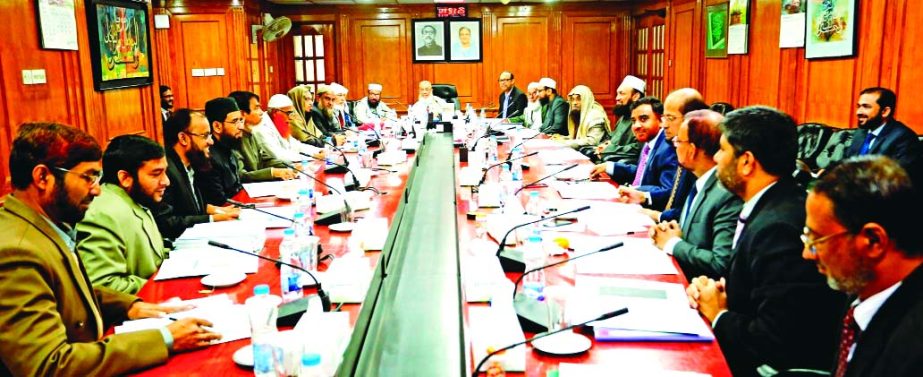 Sheikh Mohammad Qutubuddin, Chairman of Shari`ah Supervisory Committee of Islami Bank Bangladesh Limited, presiding over its meeting at the bank's head office in the city recently. Md. Mahbub ul Alam, CEO of the bank and Dr. Mohammad Abdus Samad, Member