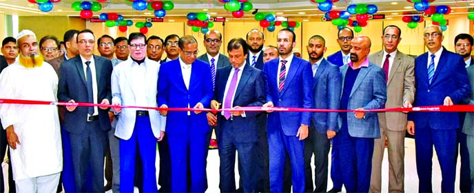 M. Sahabuddin Ahmed, Chairman of Dutch-Bangla Bank Foundation, inaugurating its corporate branch at Motijheel in the capital on Monday. Bank's Chairman Sayem Ahmed, Director Mohd. Khorshed Alam and Managing Director Abul Kashem Md Shirin, among others, w