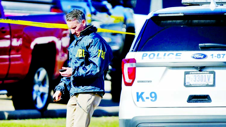 An FBI agent at West Freeway Church of Christ after a shooting during services.