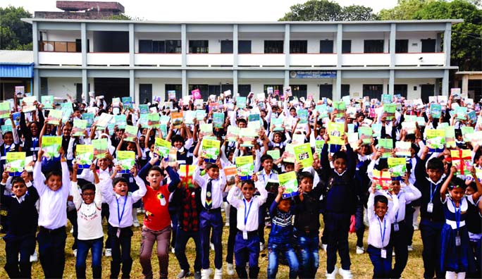 BOGURA: Students of Palli Unnoyan Academy Laboratory School and College in Bogura rejoicing after getting new textbooks marking the National Textbook Distribution Festival yesterday.