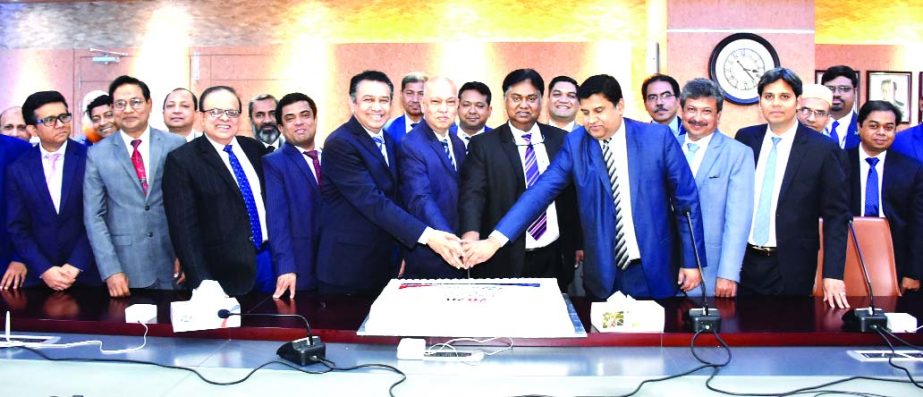 Mosleh Uddin Ahmed, Managing Director of NCC Bank Limited, celebrating 'Happy New Year-2020' through cutting a cake at its head office in the city on Wednesday. Khondoker Nayeemul Kabir, DMD, Muhammad H. Kafi, Head of Operations, Mohammed Mizanur Rahman