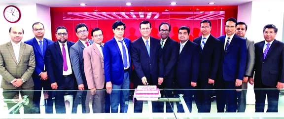 Md Ahsan-uz Zaman, Managing Director of Midland Bank Limited (MDB), cutting a cake along with Mohammad Masoom, Additional Managing Director, for crossing one lac customer relationship milestone at the bank's head office in the city recently.