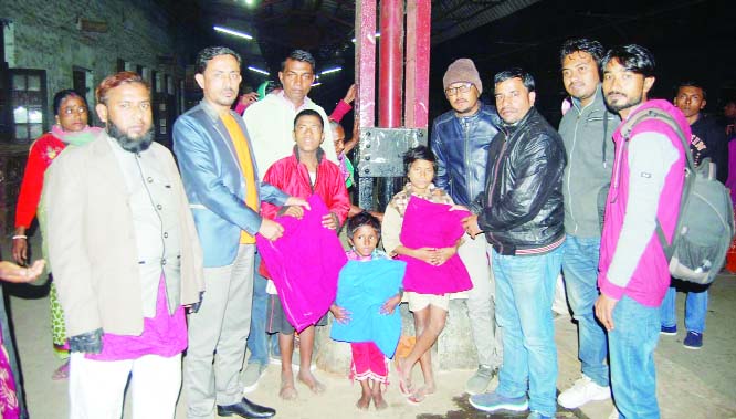 SYLHET: Leaders of Sylhet Progati Pathoshishu Kalyan Society distributing blankets among street children at Sylhet Railway Station on Tuesday .