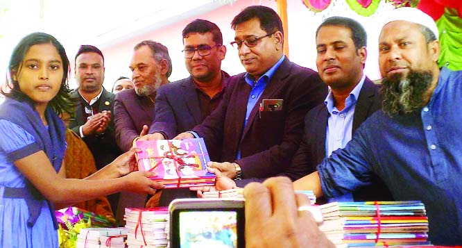 SAGHATA (Gaibandha): Upazila Parishad Chairman Jahangir Kabir distributing books among the students at Bonarpara Boys' High School on Thursday.