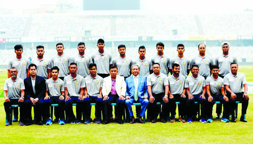 Members of Bangladesh U-19 team pose for a photograph with BCB President Nazmul Hassan Papon at the Sher-e-Bangla National Cricket Stadium in the capital on Thursday. The team will play in the World Cup U-19 Cricket in South Africa.