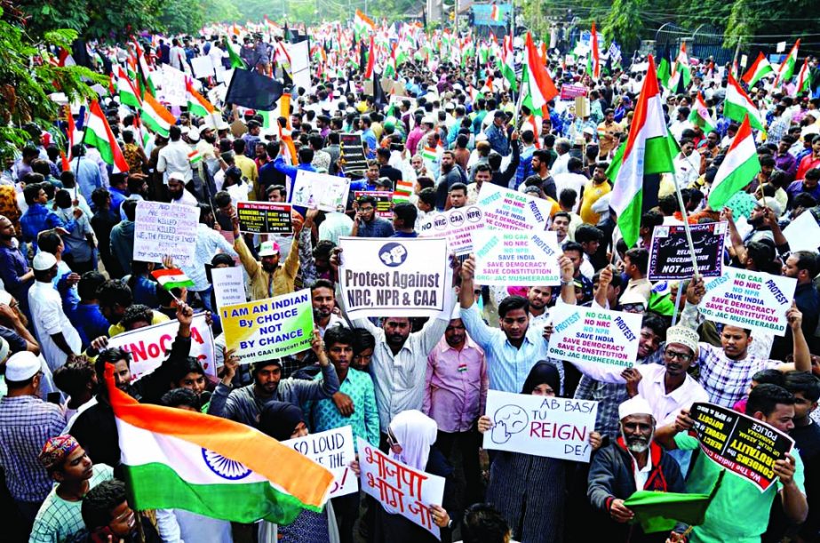 Demonstrators hold placards and flags as they attend a protest rally against a new citizenship law, in Hyderabad, India, on Saturday. Internet photo