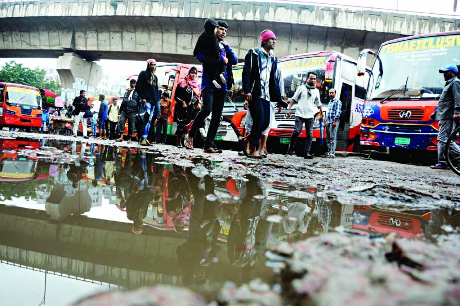 The road under the Mayor Mohammad Hanif Flyover near the capital's Jatrabari-Syedabad intersection is in dilapidated condition mainly due to poor maintenance and repair by the Dhaka South City Corporation (DSCC). The road is plagued with potholes making